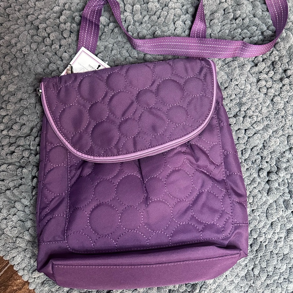 Thirty-One backpack convertible plum quilted into a shoulder bag and crossbody